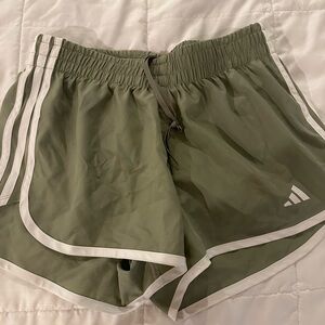 Adidas Green Athletic Shorts with Three-Stripe Design